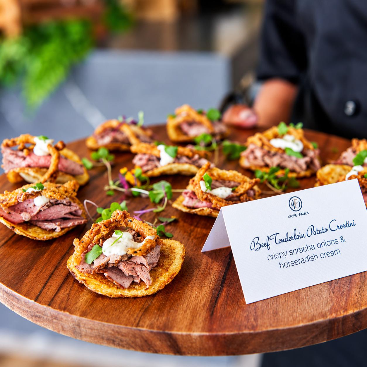 Beef tenderloin potato crostini with crispy onions and horseradish cream