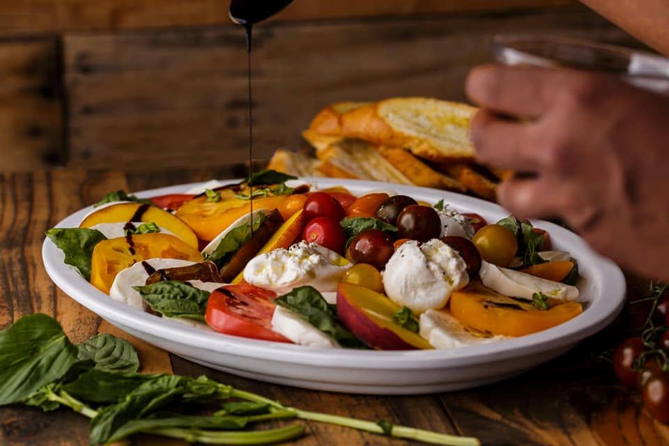 Burrata and heirloom tomato salad finished with balsamic