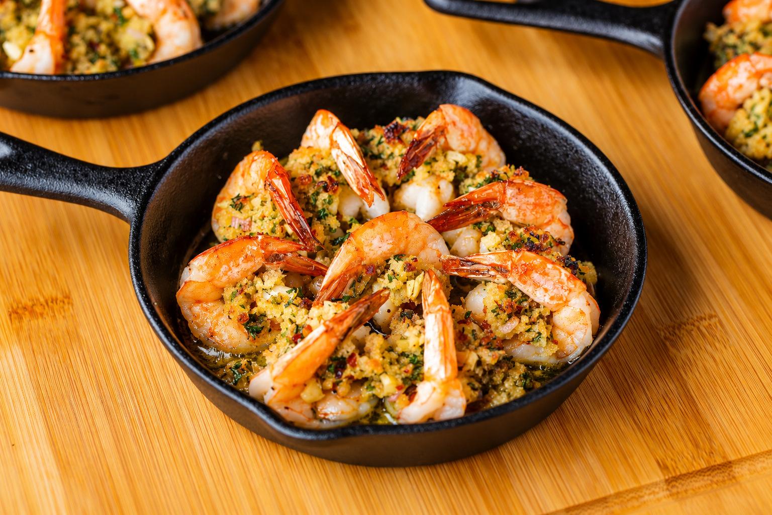Herb-crusted stuffed shrimp in a cast iron skillet
